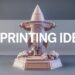 A model rocket emblazoned with 3D PRINTING IDEAS ascends against a dark backdrop, symbolizing the launch of innovative projects and the ignition of creativity in 3D printing.